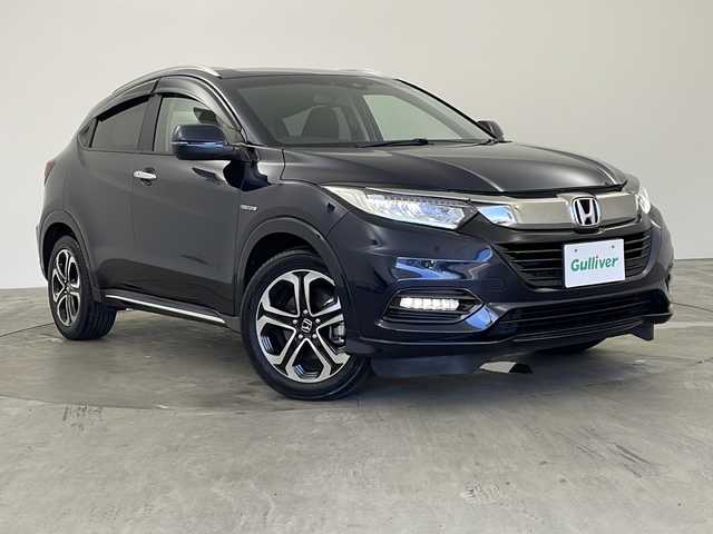 ホンダ ヴェゼル ハイブリッド Z ホンダセンシング 兵庫県 2019(令1)年 5.3万km ミッドナイトブルービームM ・純正8インチナビ/TV/Bluetooth/CD/DVD/SD/・バックカメラ/・Honda SENSING/・衝突軽減ブレーキ〈CMBS〉/・誤発進抑制機能/・歩行者事故低減ステアリング/・路外逸脱抑制機能/・ACC〈アダプティブ・クルーズ・コントロール〉/・LKAS〈車線維持支援システム〉、/・先行車発進お知らせ機能/・標識認識機能/・アイドリングストップシステム/・ハーフレザーシート/・前席シートヒーター/・純正フロアマット/・プラズマクラスター/・自動防眩ミラー/・LEDオートライト/・LEDフォグライト/・純正17インチアルミホイール/・コンフォートビュー/・ビルトインETC/・スマートキー/・パドルシフト/・カーテンエアバッグ