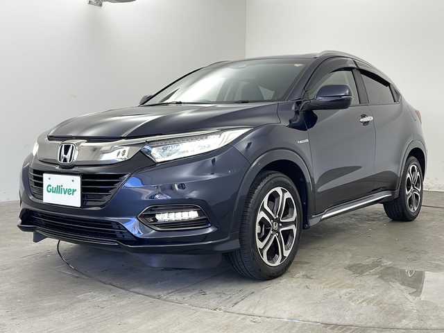 ホンダ ヴェゼル ハイブリッド Z ホンダセンシング 兵庫県 2019(令1)年 5.3万km ミッドナイトブルービームM ・純正8インチナビ/TV/Bluetooth/CD/DVD/SD/・バックカメラ/・Honda SENSING/・衝突軽減ブレーキ〈CMBS〉/・誤発進抑制機能/・歩行者事故低減ステアリング/・路外逸脱抑制機能/・ACC〈アダプティブ・クルーズ・コントロール〉/・LKAS〈車線維持支援システム〉、/・先行車発進お知らせ機能/・標識認識機能/・アイドリングストップシステム/・ハーフレザーシート/・前席シートヒーター/・純正フロアマット/・プラズマクラスター/・自動防眩ミラー/・LEDオートライト/・LEDフォグライト/・純正17インチアルミホイール/・コンフォートビュー/・ビルトインETC/・スマートキー/・パドルシフト/・カーテンエアバッグ