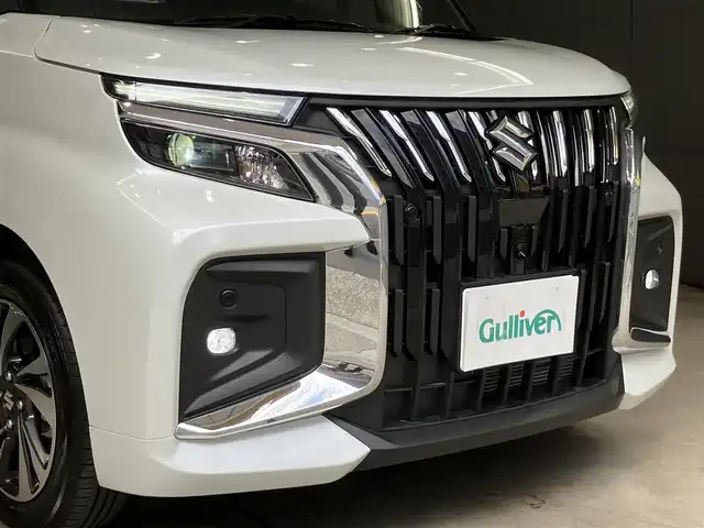 スズキ ソリオ バンディット HV MV 東京都 2025(令7)年 0.4万km ピュアホワイトパール/ガンメタリック2トーン 4WD/ワンオーナー/2トーンルーフ仕様/セーフティサポート/・デュアルセンサーサポート2/・誤発進抑制機能/・後方誤発進抑制機能/・パーキングセンサー/・低速時ブレーキサポート（前進・後退）/・車線逸脱抑制機能/・車線逸脱警告機能/・ふらつき警告機能/・標識認識機能/・ハイビームアシスト/・ブラインドスポットモニター/・アクティブクルーズコントロール/両側パワースライドドア/純正9インチナビ/・地デジ/DVD/CD/USBソケット/全方位カメラ/AppleCarPlay Android auto/プッシュスタート/ヘッドアップディスプレイ/シートヒーター /保証書・取扱説明書・スペアキー