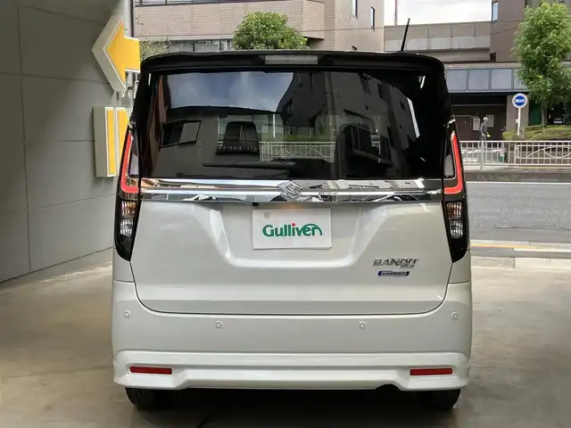 スズキ ソリオ バンディット HV MV 東京都 2025(令7)年 0.4万km ピュアホワイトパール/ガンメタリック2トーン 4WD/ワンオーナー/2トーンルーフ仕様/セーフティサポート/・デュアルセンサーサポート2/・誤発進抑制機能/・後方誤発進抑制機能/・パーキングセンサー/・低速時ブレーキサポート（前進・後退）/・車線逸脱抑制機能/・車線逸脱警告機能/・ふらつき警告機能/・標識認識機能/・ハイビームアシスト/・ブラインドスポットモニター/・アクティブクルーズコントロール/両側パワースライドドア/純正9インチナビ/・地デジ/DVD/CD/USBソケット/全方位カメラ/AppleCarPlay Android auto/プッシュスタート/ヘッドアップディスプレイ/シートヒーター /保証書・取扱説明書・スペアキー