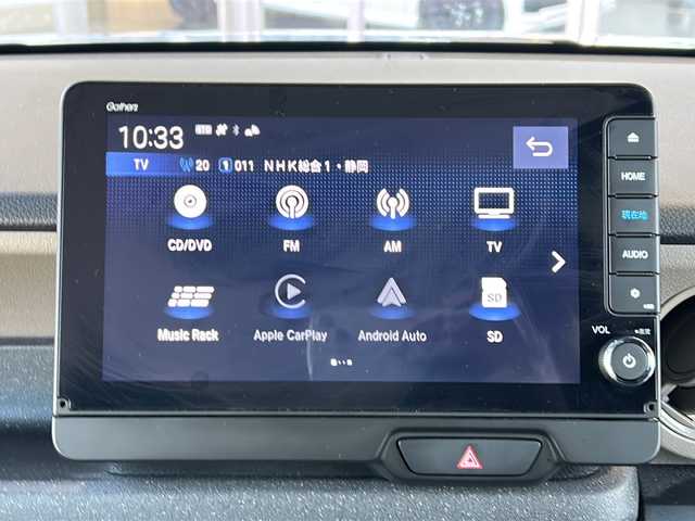 ホンダ Ｎ ＢＯＸ JOY 静岡県 2025(令7)年 1.2万km グレーⅡ 純正ナビ/・CD/DVD/・FM/AM/・フルセグTV/・Music Rack/・Apple Car Play/・Android Auto/・SD/・USB/・Bluetooth/ホンダセンシング/●衝突軽減ブレーキ（CMBS）/●先行車発進お知らせ機能/●歩行者事故低減ステアリング/●路外逸脱抑制機能/●標識認識機能/●渋滞追従機能付ACC/●車線維持支援システム（LKAS）/●誤発進抑制機能/●後方誤発進抑制機能/●近距離衝突軽減ブレーキ/●急アクセル抑制機能/●パーキングセンサーシステム/●オートハイビーム/主要装備/・ドライブレコーダー/・ＥＴＣ/・２トーンカラー/・運転席＋助手席シートヒーター/・両側パワスラ/・チェック柄撥水ファブリック/・サイドカーテンエアバッグ/・バックカメラ