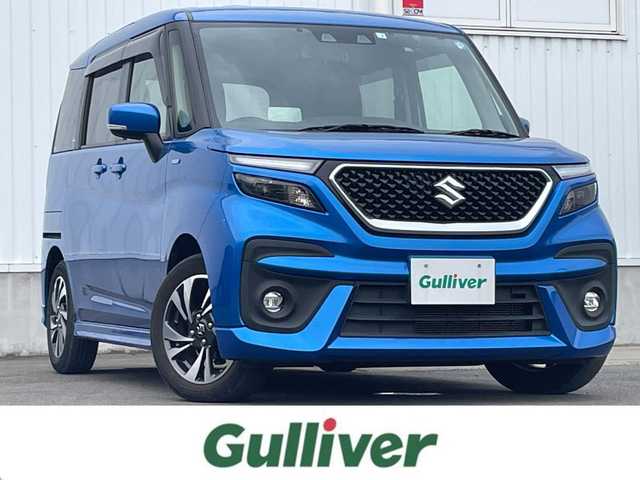 スズキ ソリオ バンディット HV MV 愛媛県 2022(令4)年 3万km スピーディーブルーM 左側パワースライドドア/社外ナビ(CD/DVD)/後席モニター/ミラー型前後ドライブレコーダー/レーダークルーズコントロール/アイドリングストップ/レーンキープアシスト/コーナーセンサー/LEDヘッドライト/オートライト/フォグランプ/純正フロアマット/純正ドアバイザー/純正アルミホイール/デュアルカメラブレーキサポート/横滑り防止装置/スマートキー/プッシュスタート/ABS