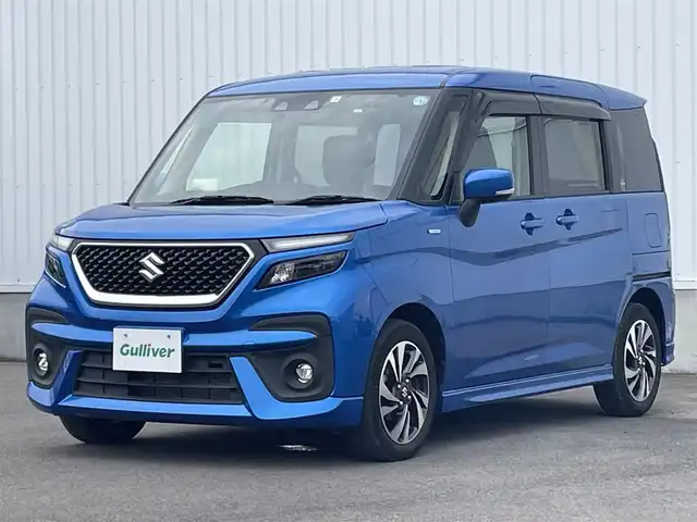 スズキ ソリオ バンディット HV MV 愛媛県 2022(令4)年 3万km スピーディーブルーM 左側パワースライドドア/社外ナビ(CD/DVD)/後席モニター/ミラー型前後ドライブレコーダー/レーダークルーズコントロール/アイドリングストップ/レーンキープアシスト/コーナーセンサー/LEDヘッドライト/オートライト/フォグランプ/純正フロアマット/純正ドアバイザー/純正アルミホイール/デュアルカメラブレーキサポート/横滑り防止装置/スマートキー/プッシュスタート/ABS