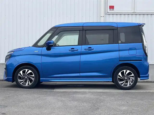 スズキ ソリオ バンディット HV MV 愛媛県 2022(令4)年 3万km スピーディーブルーM 左側パワースライドドア/社外ナビ(CD/DVD)/後席モニター/ミラー型前後ドライブレコーダー/レーダークルーズコントロール/アイドリングストップ/レーンキープアシスト/コーナーセンサー/LEDヘッドライト/オートライト/フォグランプ/純正フロアマット/純正ドアバイザー/純正アルミホイール/デュアルカメラブレーキサポート/横滑り防止装置/スマートキー/プッシュスタート/ABS