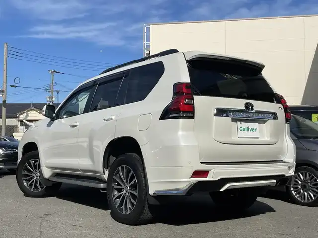 トヨタ ランドクルーザー プラド TX Lパッケージ 和歌山県 2021(令3)年 5.7万km ホワイトパールクリスタルシャイン ワンオーナー/モデリスタエアロ/サンルーフ/ディーラー純正ナビ/（AM/FM/フルセグTV/CD/DVD/SD/SDREC/Bluetooth）/D・N席パワーシート/シートヒーター/ベンチレーション/オートハイビーム/クルーズコントロール/LDA/クリアランスソナー/PCS/RSA/プッシュスタート/ETC/ドライブレコーダー/保証書/取扱説明書/スペアキー×１