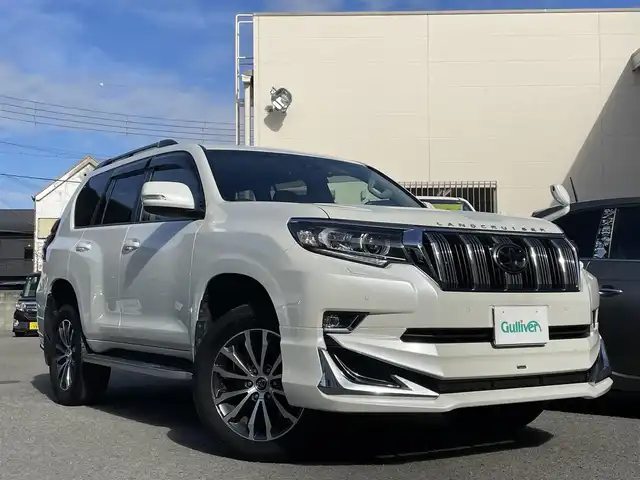 トヨタ ランドクルーザー プラド TX Lパッケージ 和歌山県 2021(令3)年 5.7万km ホワイトパールクリスタルシャイン ワンオーナー/モデリスタエアロ/サンルーフ/ディーラー純正ナビ/（AM/FM/フルセグTV/CD/DVD/SD/SDREC/Bluetooth）/D・N席パワーシート/シートヒーター/ベンチレーション/オートハイビーム/クルーズコントロール/LDA/クリアランスソナー/PCS/RSA/プッシュスタート/ETC/ドライブレコーダー/保証書/取扱説明書/スペアキー×１