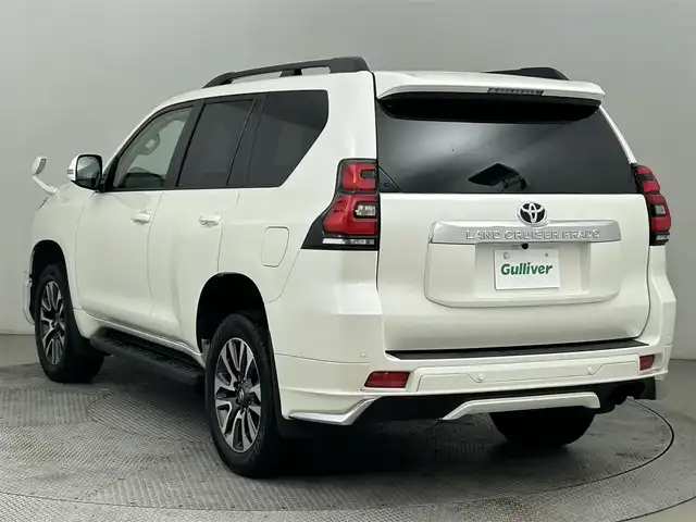 トヨタ ランドクルーザー プラド TX Lパッケージ 道央・札幌 2023(令5)年 2万km ホワイトパールクリスタルシャイン サンルーフ/モデリスタエアロ（前/後下）/ベージュレザーシート/ルーフレール/純正19インチAW/純正9インチSDナビ/（Bluetooth/フルセグTV)/プリクラッシュセーフティ/レーダークルーズコントロール/踏み間違い防止/オートハイビーム/ＬＥＤヘッドライト（Auto付）/LEDフォグランプ/ビルトインＥＴＣ/バックカメラ/シートヒーター（D/N）/エアシート（D/N）/パワーシート（D/N）/コンビハンドル/ISOFIX/ステアリングスイッチ/チルトステアリング/シートリフター/ウインカーミラー