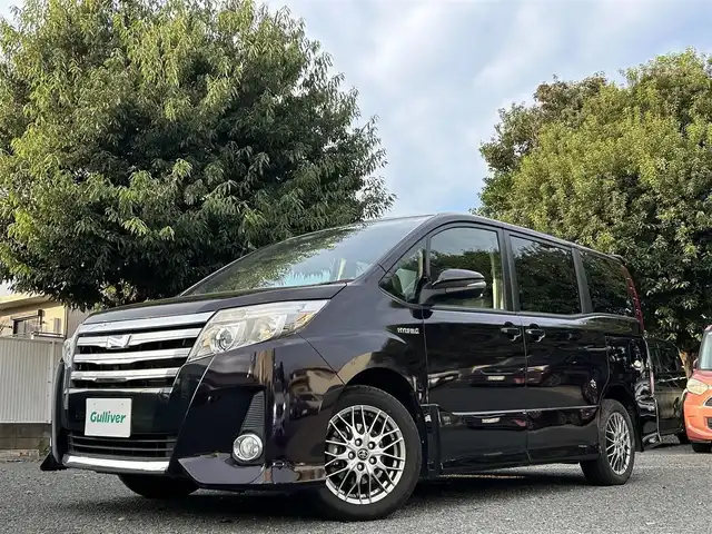 トヨタ ノア ハイブリッド Si 東京都 2016(平28)年 4.4万km ボルドーマイカメタリック ワンオーナー/純正9インチナビ/フルセグTV／Bluetoothオーディオ／DVD再生/バックカメラ/12.1型フリップダウンモニター(V12T-R66C)/両側パワースライドドア/純正ETC2.0/LEDヘッドランプ/トヨタセーフティセンス/スマートキー×2