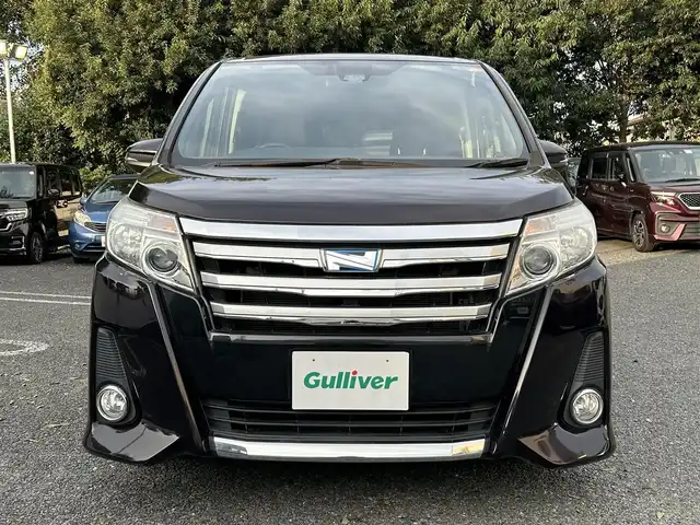 トヨタ ノア ハイブリッド Si 東京都 2016(平28)年 4.4万km ボルドーマイカメタリック ワンオーナー/純正9インチナビ/フルセグTV／Bluetoothオーディオ／DVD再生/バックカメラ/12.1型フリップダウンモニター(V12T-R66C)/両側パワースライドドア/純正ETC2.0/LEDヘッドランプ/トヨタセーフティセンス/スマートキー×2