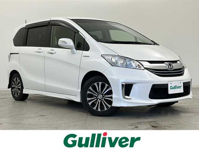 ホンダ フリード ハイブリット ジャストセレクション 宮城県 2015(平27)年 8.8万km ホワイトオーキッドパール 禁煙車/両側パワースライドドア/社外7インチナビ/（BT.CD.DVD.AUX.USB.SD）/バックカメラ/フルセグテレビ/ビルトインETC/革巻きステアリング/ステアリングスイッチ/プッシュスタート/スマートキー/スペアキー/ハーフレザーシート/純正フロアマット/純正15インチアルミホイール/社外15インチアルミホイール付冬タイヤ積込/横滑り防止機能/オートライト/パワーステアリング/パワーウインドウ