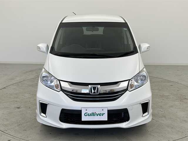 ホンダ フリード ハイブリット ジャストセレクション 宮城県 2015(平27)年 8.8万km ホワイトオーキッドパール 禁煙車/両側パワースライドドア/社外7インチナビ/（BT.CD.DVD.AUX.USB.SD）/バックカメラ/フルセグテレビ/ビルトインETC/革巻きステアリング/ステアリングスイッチ/プッシュスタート/スマートキー/スペアキー/ハーフレザーシート/純正フロアマット/純正15インチアルミホイール/社外15インチアルミホイール付冬タイヤ積込/横滑り防止機能/オートライト/パワーステアリング/パワーウインドウ