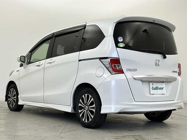 ホンダ フリード ハイブリット ジャストセレクション 宮城県 2015(平27)年 8.8万km ホワイトオーキッドパール 禁煙車/両側パワースライドドア/社外7インチナビ/（BT.CD.DVD.AUX.USB.SD）/バックカメラ/フルセグテレビ/ビルトインETC/革巻きステアリング/ステアリングスイッチ/プッシュスタート/スマートキー/スペアキー/ハーフレザーシート/純正フロアマット/純正15インチアルミホイール/社外15インチアルミホイール付冬タイヤ積込/横滑り防止機能/オートライト/パワーステアリング/パワーウインドウ