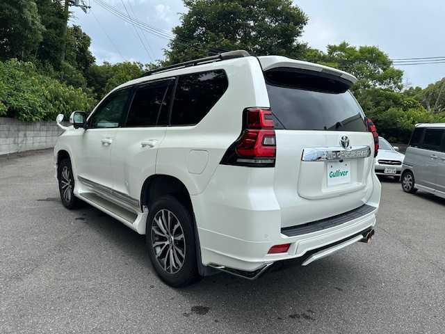 トヨタ ランドクルーザー プラド TX Lパッケージ 大阪府 2020(令2)年 3.8万km ホワイトパールクリスタルシャイン モデリスタエアロ　F/R/純正9型ナビ(NSZT-Y68T)/バック/フロントモニター/フルセグ/Bluetooth/トヨタセーフティセンス/ルーフレール/GANADORマフラー/バックミラーモニター/ブラックレザーシート/パワーシート/シートヒーター/シートベンチレーション/LEDヘッドライト/純正アルミホイール/ビルトインETC/スマートキー