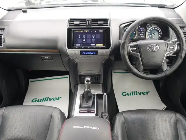 トヨタ ランドクルーザー プラド TX Lパッケージ 山形県 2018(平30)年 9.9万km ブラック 4WD/衝突被害軽減システム/純正SDナビ/　　【CD DVD BT フルセグ USB MSV】/バックカメラ/レーダークルーズコントロール/LEDオートライト/レザーシート/パワーシート/シートエアコン/シートヒーター/17インチアルミホイール/ドライブレコーダー/コーナーセンサー/ステアリングスイッチ/MTモード付AT/純正フロアマット/スマートキー/ETC2.0