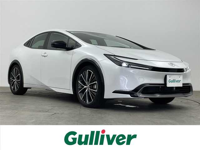 トヨタ プリウス Z 大分県 2023(令5)年 2.9万km プラチナホワイトパールマイカ ワンオーナー/禁煙車/パノラミックビューモニター/12.3型ディスプレイ/・フルセグTV、HDMI、BT対応、USB/・AppleCarPlay、AndroidAuto/TOYOTAセーフティセンス/・プリクラッシュセーフティ/・緊急時操舵支援＋FCTA＋LCA/・LTA＋LDA/・レーダークルーズコントロール/・アダプティブクルーズコントロール/・ロードサインアシスト/・ドライバー異常時対応システム/ブラインドスポットモニター/安心降車アシスト/デジタルインナーミラー /前後ドライブレコーダー/ビルトインETC2.0/ワイヤレス充電器/ステアリングスイッチ/ステアリングヒーター/パワーバックドア/横滑り防止装置/電動格納ミラー/純正フロアマット/オートライト/LEDヘッドライト/純正19インチアルミホイール/クリアランスソナー/保証書、取説、スペアキー有り