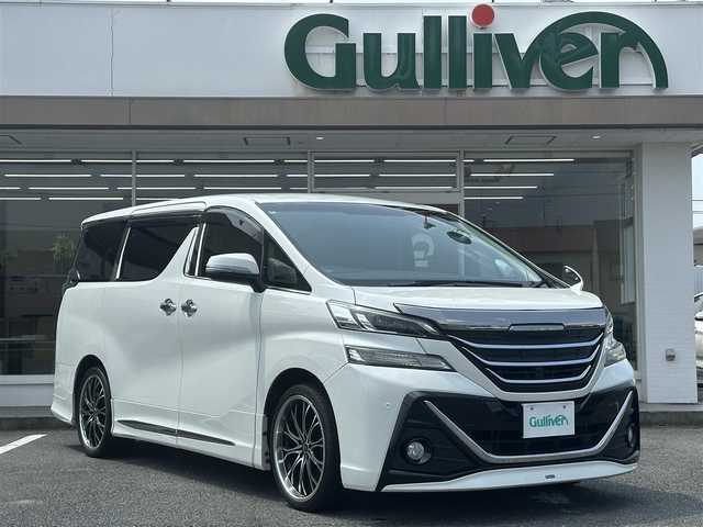 トヨタ ヴェルファイア Z 三重県 2016(平28)年 8.1万km ホワイトパールクリスタルシャイン ♪車検R9年3月30日/♪モデリスタ(エアロ/グリル/マフラー)/♪純正メーカーナビ/・フルセグ・Bluetooth・DVD再生・CD録音/♪バックカメラ/♪純正フリップダウンモニター/♪デジタルインナーミラー（ドライブレコーダー付）/♪両側パワースライドドア/♪スマートキー/♪プッシュスタート/♪LEDヘッドライト/♪LEDフォグライト /♪オートライト/♪クリアランスソナー/♪オートブレーキホールド/♪レザー調シートカバー/♪革巻きステアリング/♪ステアリングスイッチ/♪ビルトインETC/♪サイド・カーテン・ニーエアバック/♪横滑り防止機能/♪nanoe/♪プライバシーガラス/♪ドアバイザー/♪フロアマット