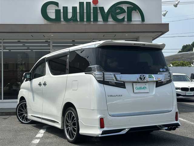 トヨタ ヴェルファイア Z 三重県 2016(平28)年 8.1万km ホワイトパールクリスタルシャイン ♪車検R9年3月30日/♪モデリスタ(エアロ/グリル/マフラー)/♪純正メーカーナビ/・フルセグ・Bluetooth・DVD再生・CD録音/♪バックカメラ/♪純正フリップダウンモニター/♪デジタルインナーミラー（ドライブレコーダー付）/♪両側パワースライドドア/♪スマートキー/♪プッシュスタート/♪LEDヘッドライト/♪LEDフォグライト /♪オートライト/♪クリアランスソナー/♪オートブレーキホールド/♪レザー調シートカバー/♪革巻きステアリング/♪ステアリングスイッチ/♪ビルトインETC/♪サイド・カーテン・ニーエアバック/♪横滑り防止機能/♪nanoe/♪プライバシーガラス/♪ドアバイザー/♪フロアマット