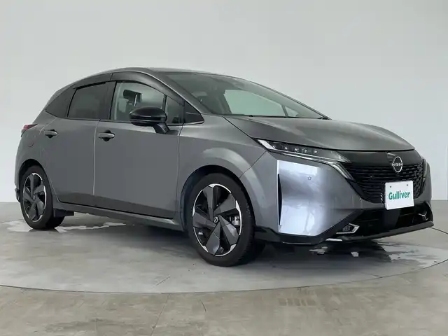 日産 オーラ G レザーエディション 鹿児島県 2023(令5)年 1万km ダークメタルグレー 純正ナビ/（BT/フルセグ/HDMI）/プロパイロット/BOSEプレミアムサウンド/アラウンドビューモニター/エマージェンシーブレーキ/デジタルインナーミラー/ワイヤレス充電/オートライト/オートマチックハイビーム/レザーシート/純正フロアマット/スマートキー/プッシュスタート/取説、保証書