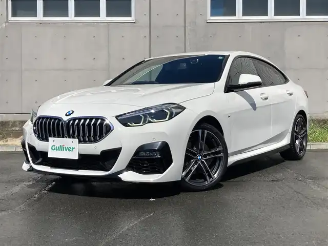 ＢＭＷ ２１８ｉ グランクーペ Mスポーツ 静岡県 2020(令2)年 2万km アルピンホワイトⅢ 純正HDDナビ/　AM FM Bluetooth USB Spotify/ETC/LEDオートヘッドランプ/レーダークルーズコントロール/ブラックレザーシート/パワーシート(前席)/シートヒーター(前席)/前後クリアランスソナー/純正18インチアルミホイール/スマートキー2本/パーキングアシスト/アイドリングストップ/ワンオーナー/バックカメラ/前後方ドライブレコーダー