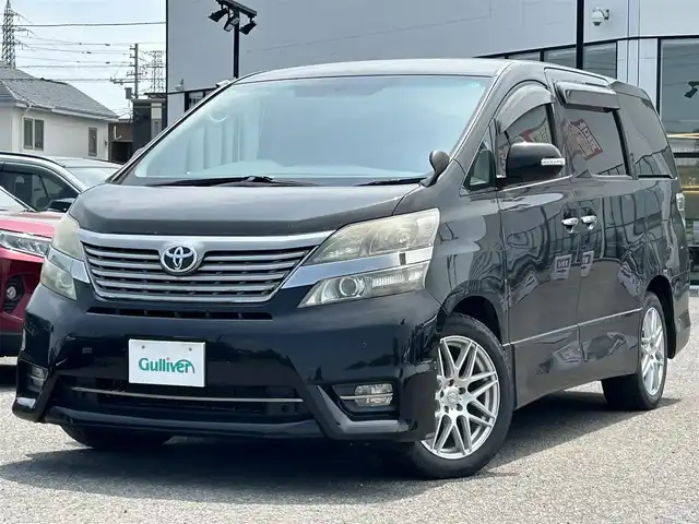 トヨタ ヴェルファイア 3．5Z サイドリフトアップ 道央・札幌 2009(平21)年 10.6万km ブラック ４WD/純正HDDナビ/AM/FM/CD/DVD/BT/フルセグ/ETC/バックカメラ/社外フリップダウンモニター/プッシュスタート/スマートキー/スペアキー/社外エンジンスターター/社外シートカバー/両側パワースライドドア/クルーズコントロール/福祉車両/４WD切替スイッチ/ステアリングスイッチ/純正フロアマット/電格ミラー/ウィンカーミラー/ドアバイザー/前後コーナーセンサー