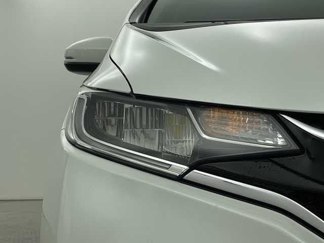 ホンダ フィット 13G L ホンダセンシング 新潟県 2019(平31)年 1.6万km プラチナホワイトパール ホンダセンシング/純正8インチSDナビ/　CD/DVD/Bluetooth/フルセグTV/バックカメラ/レーダークルーズコントロール/LEDヘッドライト/LEDフォグランプ/電格ミラー/ウィンカーミラー/ドラレコ/スマートキー/ビルトインETC