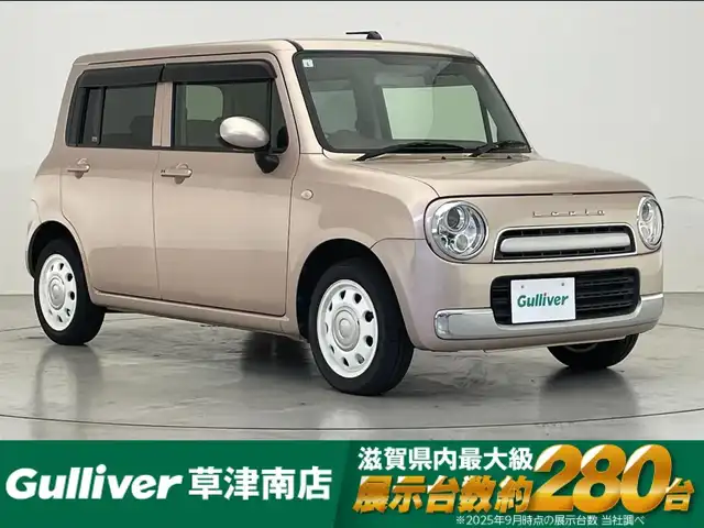 スズキ ラパン ショコラ G 滋賀県 2015(平27)年 6.4万km シャンパンピンクPM 社外ナビ/(CD/ワンセグTV)/ビルトインETC/ドライブレコーダー/レザーシート/HIDヘッドライト/純正フロアマット/純正14インチAW