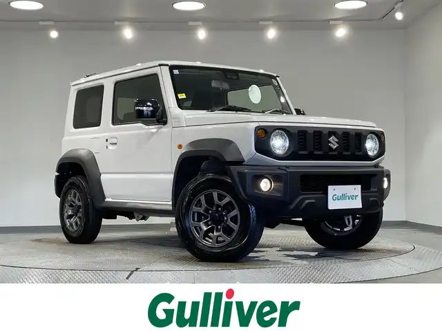 スズキ ジムニー シエラ JC 愛知県 2023(令5)年 2.9万km ピュアホワイトP 9インチナビ/（Bluetooth/AM/FM/フルセグTV/Carplay）/衝突軽減ブレーキ/ビルトインETC/シートヒーター/LEDヘッドライト/バックカメラ/クルーズコントロール/レーンキープアシスト/プッシュスタートボタン/スマートキー/純正15インチAW/純正フロアマット