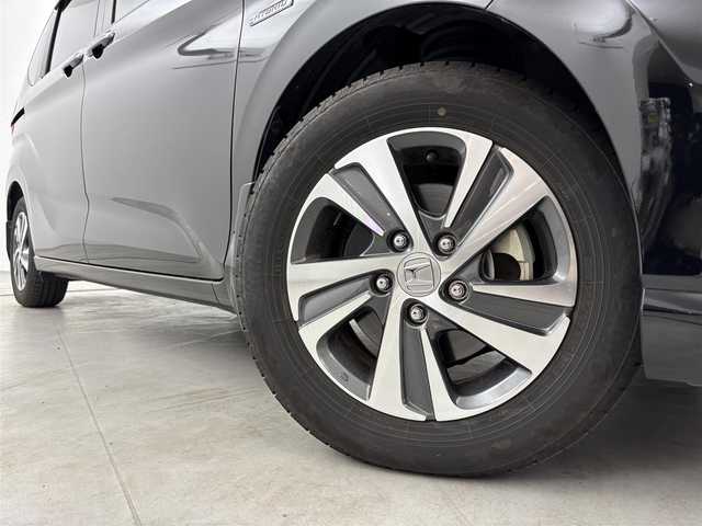 ホンダ フリード ハイブリット G ホンダセンシング 福岡県 2020(令2)年 2.8万km 黒 純正９型ナビ／フルセグＴＶ　/バックカメラ　/ビルトインＥＴＣ　/前方ドラレコ　/レーダークルコン　/コーナーセンサー　/衝突軽減ブレーキ　/レーンキープ　/両側電動スライドドア　/ハーフレザーシート　/シートヒーター　/LEDヘッドライト　/純正１５インチアルミホイール