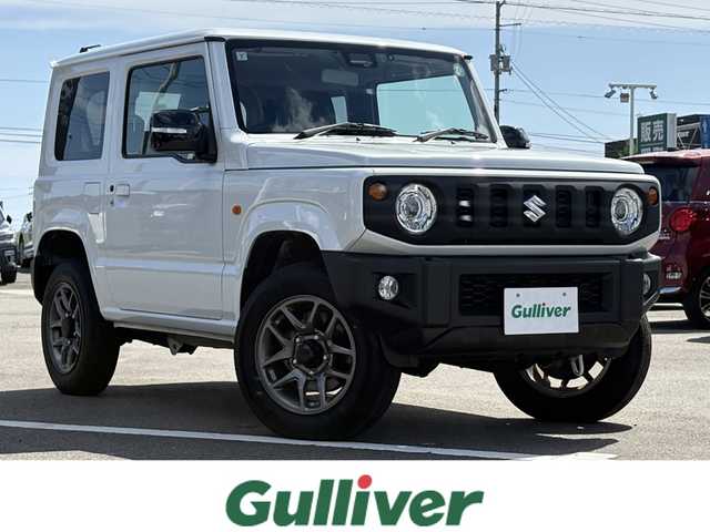 スズキ ジムニー XC 徳島県 2024(令6)年 1.8万km ピュアホワイトP 4WD/ICターボ/7インチメモリナビ/（Bluetooth/CD）/バックカメラ/シートヒーター（D+N席）/クルーズコントロール/クリアランスソナー/LEDヘッドライト/オートハイビーム/オートライト/ドライブレコーダー/純正16AW/ヘッドライトウォッシャー/アイドリングストップ/スペアキー