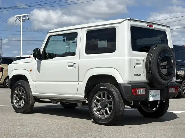 スズキ ジムニー XC 徳島県 2024(令6)年 1.8万km ピュアホワイトP 4WD/ICターボ/7インチメモリナビ/（Bluetooth/CD）/バックカメラ/シートヒーター（D+N席）/クルーズコントロール/クリアランスソナー/LEDヘッドライト/オートハイビーム/オートライト/ドライブレコーダー/純正16AW/ヘッドライトウォッシャー/アイドリングストップ/スペアキー