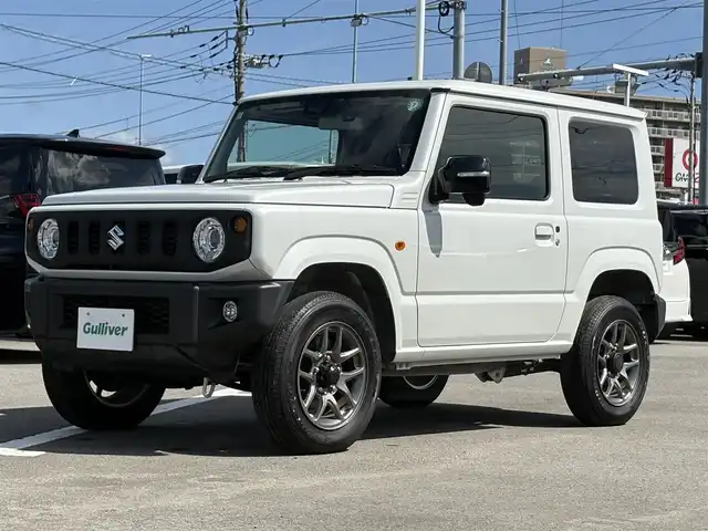 スズキ ジムニー XC 徳島県 2024(令6)年 1.8万km ピュアホワイトP 4WD/ICターボ/7インチメモリナビ/（Bluetooth/CD）/バックカメラ/シートヒーター（D+N席）/クルーズコントロール/クリアランスソナー/LEDヘッドライト/オートハイビーム/オートライト/ドライブレコーダー/純正16AW/ヘッドライトウォッシャー/アイドリングストップ/スペアキー