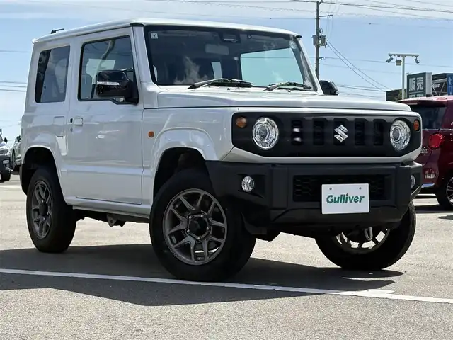 スズキ ジムニー XC 徳島県 2024(令6)年 1.8万km ピュアホワイトP 4WD/ICターボ/7インチメモリナビ/（Bluetooth/CD）/バックカメラ/シートヒーター（D+N席）/クルーズコントロール/クリアランスソナー/LEDヘッドライト/オートハイビーム/オートライト/ドライブレコーダー/純正16AW/ヘッドライトウォッシャー/アイドリングストップ/スペアキー