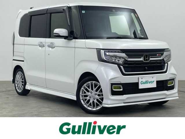 ホンダ Ｎ ＢＯＸ カスタム L ターボ 大分県 2022(令4)年 4.2万km プラチナホワイトパール 無限エアロ/ホンダセンシング搭載/・衝突軽減ブレーキ（CMBS）/・誤発進抑制機能/・歩行者事故低減ステアリング/・路外逸脱抑制機能/・ACC（渋滞追従機能付き）/・車線維持支援システム（LAKS）/・先行車発進お知らせ機能/・標識認識機能/・後方誤発進抑制機能/・オートハイビーム/純正8型ナビ　型式：VXU-227NBi/・フルセグTV、DVD再生可、BT対応、USB/・AppleCarPlay、AM/FM/ステアリングスイッチ/バックカメラ/ナビ連動ドライブレコーダー/ETC/ハーフレザーシート/・前席シートヒーター/アイドリングストップ/横滑り防止装置/電動格納ミラー/純正フロアマット/オートライト/LEDヘッドライト/シーケンシャルウインカー/LEDフォグ/純正15インチアルミホイール/純正エンジンスターター