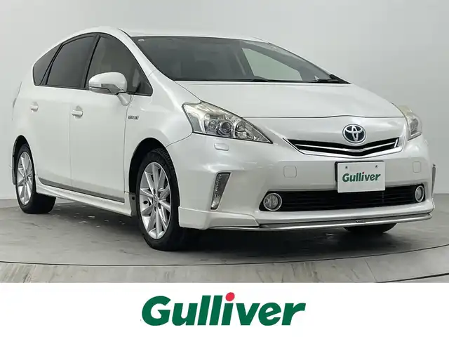 トヨタ プリウス α S ツーリングセレクション 熊本県 2013(平25)年 11.6万km ホワイトパールクリスタルシャイン モデリスタエアロ/純正HDDナビ/・フルセグTV/CD/DVD/BT/・バックカメラ/純正フリップダウンモニター/クルーズコントロール/ハーフレザー調シートカバー/ビルトインETC/ステアリングリモコン/オートライト/LEDヘッドライト/スマートキー/スペアキー/プッシュスタート/純正フロアマット/純正17インチアルミホイール