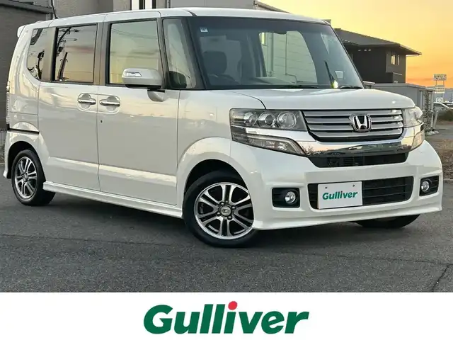ホンダ Ｎ ＢＯＸ カスタム SSパッケージ 奈良県 2015(平27)年 5.8万km プレミアムホワイトパール 純正ナビ(VXM-145VSi)/（ワンセグ/BT/CD/DVD）/バックカメラ/横滑り防止/アイドリングストップ/両側パワースライドドア/オートライト/電動格納ミラー/プッシュスタート/純正14インチAW