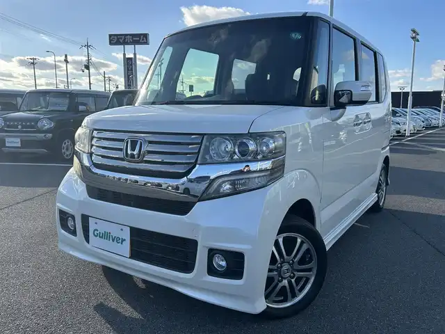ホンダ Ｎ ＢＯＸ カスタム SSパッケージ 奈良県 2015(平27)年 5.8万km プレミアムホワイトパール 純正ナビ(VXM-145VSi)/（ワンセグ/BT/CD/DVD）/バックカメラ/横滑り防止/アイドリングストップ/両側パワースライドドア/オートライト/電動格納ミラー/プッシュスタート/純正14インチAW