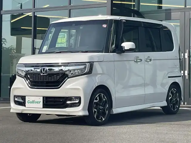 ホンダ Ｎ ＢＯＸ カスタム G EX ターボ ホンダセンシング 愛媛県 2018(平30)年 4万km プラチナホワイトパール ホンダセンシング/アダプティブクルーズコントロール/衝突被害軽減ブレーキ/車線逸脱警報/前後誤発進抑制機能/バックセンサー/ロードサインアシスト/純正8インチナビ【VXU-185NBi 】/　CD/DVD/Bluetooth/フルセグTV/ガイドライン付きバックカメラ/ビルトインETC/前方ドライブレコーダー/両側パワースライドドア/ハーフレザーシート/オートライト/LEDヘッドライト/フロントフォグライト/革巻きステアリング/ステアリングスイッチ/パドルシフト/リアサンシェード/フロアマット/プッシュスタート