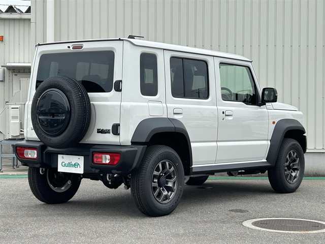 スズキ ジムニー ノマド FC 富山県 2025(令7)年 0.1万km未満 アークティックホワイトパール ワンオーナー/4WD/デュアルカメラブレーキサポート/レーダークルーズコントロール/クリアランスソナー/レーンキープアシスト/ダウンヒルアシストコントロール/オートマチックハイビーム/アイドリングストップ/助手席運転席シートヒーター/純正AW/スペアキー
