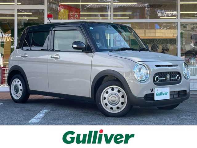 スズキ ラパン ＬＣ X 岐阜県 2025(令7)年 0.2万km フォーンベージュメタリック/アーバンブラウン 2トーン ワンオーナー/4WD/純正ディスプレイオーディオ/【Bluetooth．USB.AM/FM】/ハーフレザーシート/シートヒーター/コーナーセンサー/レーンキープアシスト/衝突被害軽減システム/バックカメラ/ドライブレコーダー/ETC/純正フロアマット/横滑り防止装置/ウィンカーミラー/ドアバイザー/スマートキー/保証書/取扱説明書/スペアキー