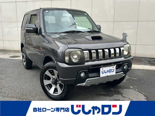 スズキ ジムニー クロスアドベンチャー XC 埼玉県 2011(平23)年 10.7万km クエーサーグレーメタリック (株)IDOMが運営する【じしゃロン熊谷店】の自社ローン専用車両になりますこちらは現金またはオートローンご利用時の価格です。自社ローンご希望の方は別途その旨お申付け下さい/5MT/メッキグリル/パートタイム4WD/黒レザーシート/シートヒーター/carrozzeriaオーディオ（CD）/ETC/純正16インチAW/フォグランプ/キーレス/フロアマット/ドアバイザー/革巻きステア