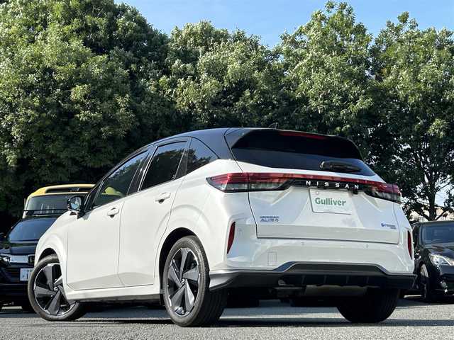 日産 オーラ G FOUR レザーエディション 東京都 2023(令5)年 1.2万km ピュアホワイトパール / スーパーブラック 2トーン ワンオーナー/純正ナビ（9インチ）/・Bluetoothオーディオ/USBオーディオ/・Apple CarPlay/AndroidAuto/フルセグTV/プロパイロット/BOSEパーソナルプラスサウンドシステム/ワイヤレス充電器/本革シート/ビルトインETC2.0/取扱説明書/保証書/スペアキー1本