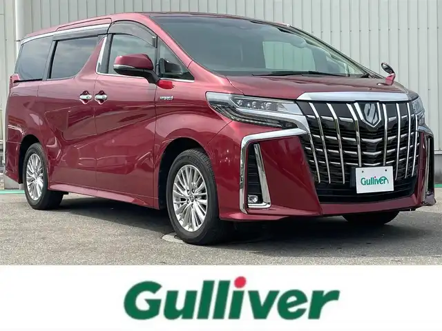 トヨタ アルファードハイブリット SR Cパッケージ 富山県 2019(令1)年 2.6万km ダークレッドマイカメタリック 純正10インチナビ＆フルセグTV/（BT＆CD＆DVD＆USB＆SD)/サンルーフ/後席モニター/デジタルインナーミラー/バックカメラ/レーダークルーズコントロール/前席（パワーシート＆シートヒーター＆エアシート）/前後ドラレコ/ウッドコンビステアリング/ステアリングヒーター/オットマン/三眼ヘッドライト/BSM/オートライト/LEDライト/シーケンシャルウィンカー/ビルトインETC