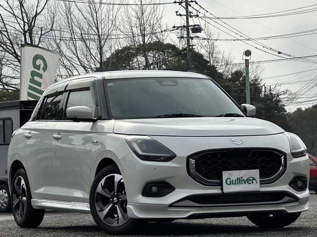 スズキ スイフト HYBRID MZ 大分県 2024(令6)年 0.1万km未満 ピュアホワイトP 登録済み未使用車/全方位カメラ/純正ディスプレイオーディオ/純正16インチアルミホイール/純正LEDヘッドライト/シートヒーター/オートホールド/ステアリングリモコン/5月3日から5月7日までお休みの為、書類発送及び車両搬出は5月8日以降になります。