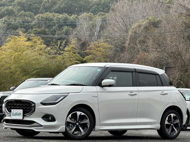 スズキ スイフト HYBRID MZ 大分県 2024(令6)年 0.1万km未満 ピュアホワイトP 登録済み未使用車/全方位カメラ/純正ディスプレイオーディオ/純正16インチアルミホイール/純正LEDヘッドライト/シートヒーター/オートホールド/ステアリングリモコン/5月3日から5月7日までお休みの為、書類発送及び車両搬出は5月8日以降になります。