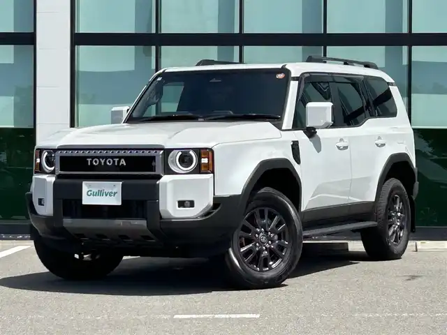 トヨタ ランドクルーザー ２５０ VX 和歌山県 2025(令7)年 0.1千km プラチナホワイトパールマイカ 純正12.3インチナビ/全方位カメラ/フルセグTV/HDMI/衝突被害軽減ブレーキ/レーダークルーズコントロール/レーンキープアシスト/オートライト/前後コーナーセンサー/ブラインドスポットモニター/サンルーフ/純正マットガード/デジタルインナーミラー/ビルトインETC2.0/純正ドラレコ/前席/・シートベンチレーション/・シートヒーター/・パワーシート/電動リアゲート/ルーフレール/ステアリングリモコン/LEDヘッドライト/フォグランプ