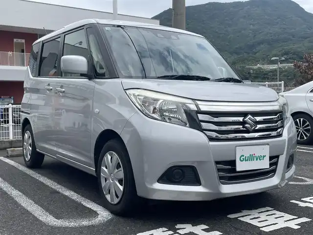 スズキ ソリオ G 長崎県 2020(令2)年 8.3万km スターシルバーメタリック ・プッシュスタート/・社外SDナビ（AM/FM/DVD）/・ブルートゥース/・クルーズコントロール/・ステアリングスイッチ/・バックカメラ/・ETC/・横滑り防止装置/・電格ミラー/・コーナーセンサー（後）/・衝突軽減ブレーキ/・片側パワースライドドア/・オートライト