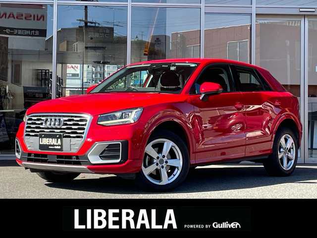 アウディ Ｑ２ 30TFSIスポーツ 福岡県 2019(令1)年 2.9万km 赤 ナビゲーションパッケージ/・MMIナビゲーションシステム/・TVチューナー/・8スピーカー/・スマートフォンインターフェイス/・Audi connect/バーチャルコックピット/アシスタンスパッケージ/・サイドアシスト/・アクティブレーンアシスト/・トラフィックジャムアシスト/・リヤクロストラフィックアシスト/・プレセンスベーシック/・ハイビームアシスト/アダプティブクルーズコントロール /ベーシックパッケージ/・デラックスオートマチックエアコンディショナー/・ルームミラー 自動防眩/・DIS（ドライバーインフォメーションシステム）/・ステアリングホイール 3スポークレザー/・センターアームレス/コンビニエンスパッケージ/・アドバンストキーシステム/・リヤビューカメラ/・アウディパーキングシステム/LEDライトパッケージ/・LEDヘッドライト/・LEDリヤダイナミックターンインディケーター/・ヘッドライトウォッシャー/・LEDインテリアライティング/オートマチックテールゲート/ＡＵＤＩドライブセレクト/シートヒーター/アドバンストキー/パーキングエンド/ETC/電動パーキング/純正17インチAW