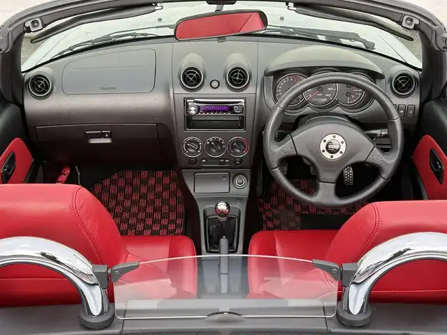 ダイハツ コペン アクティブトップ 岩手県 2002(平14)年 2.2万km ブライトシルバーメタリック 禁煙車/5MT/赤レザーシート/momoステアリング/ファッションバー/前席シートヒーター/電動オープン/フォグライト/〇キーレス/〇電動ミラー/〇社外フロアマット/〇シガーソケット/〇パワーウィンドウ/〇パワーステアリング/取扱説明書