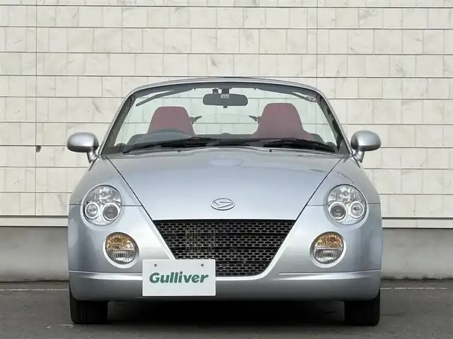 ダイハツ コペン アクティブトップ 岩手県 2002(平14)年 2.2万km ブライトシルバーメタリック 禁煙車/5MT/赤レザーシート/momoステアリング/ファッションバー/前席シートヒーター/電動オープン/フォグライト/〇キーレス/〇電動ミラー/〇社外フロアマット/〇シガーソケット/〇パワーウィンドウ/〇パワーステアリング/取扱説明書