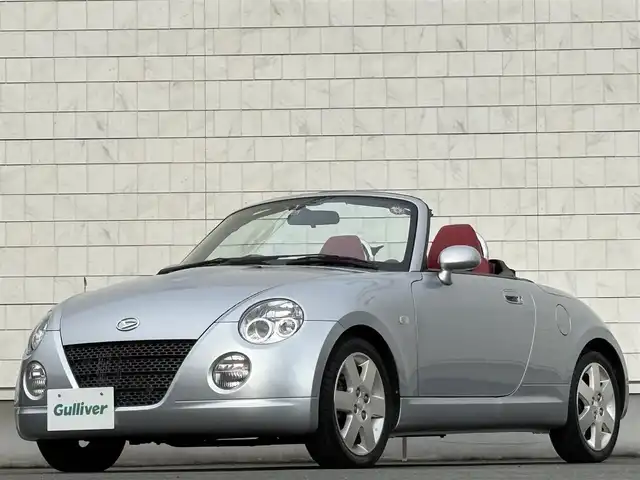 ダイハツ コペン アクティブトップ 岩手県 2002(平14)年 2.2万km ブライトシルバーメタリック 禁煙車/5MT/赤レザーシート/momoステアリング/ファッションバー/前席シートヒーター/電動オープン/フォグライト/〇キーレス/〇電動ミラー/〇社外フロアマット/〇シガーソケット/〇パワーウィンドウ/〇パワーステアリング/取扱説明書